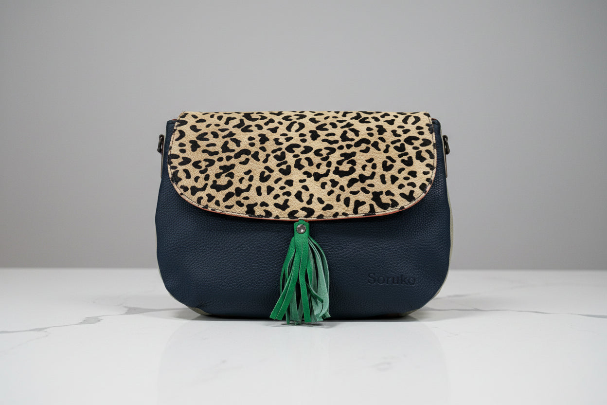 handbag ide 2
dark navy leather with leopard animal print flap and green tassel