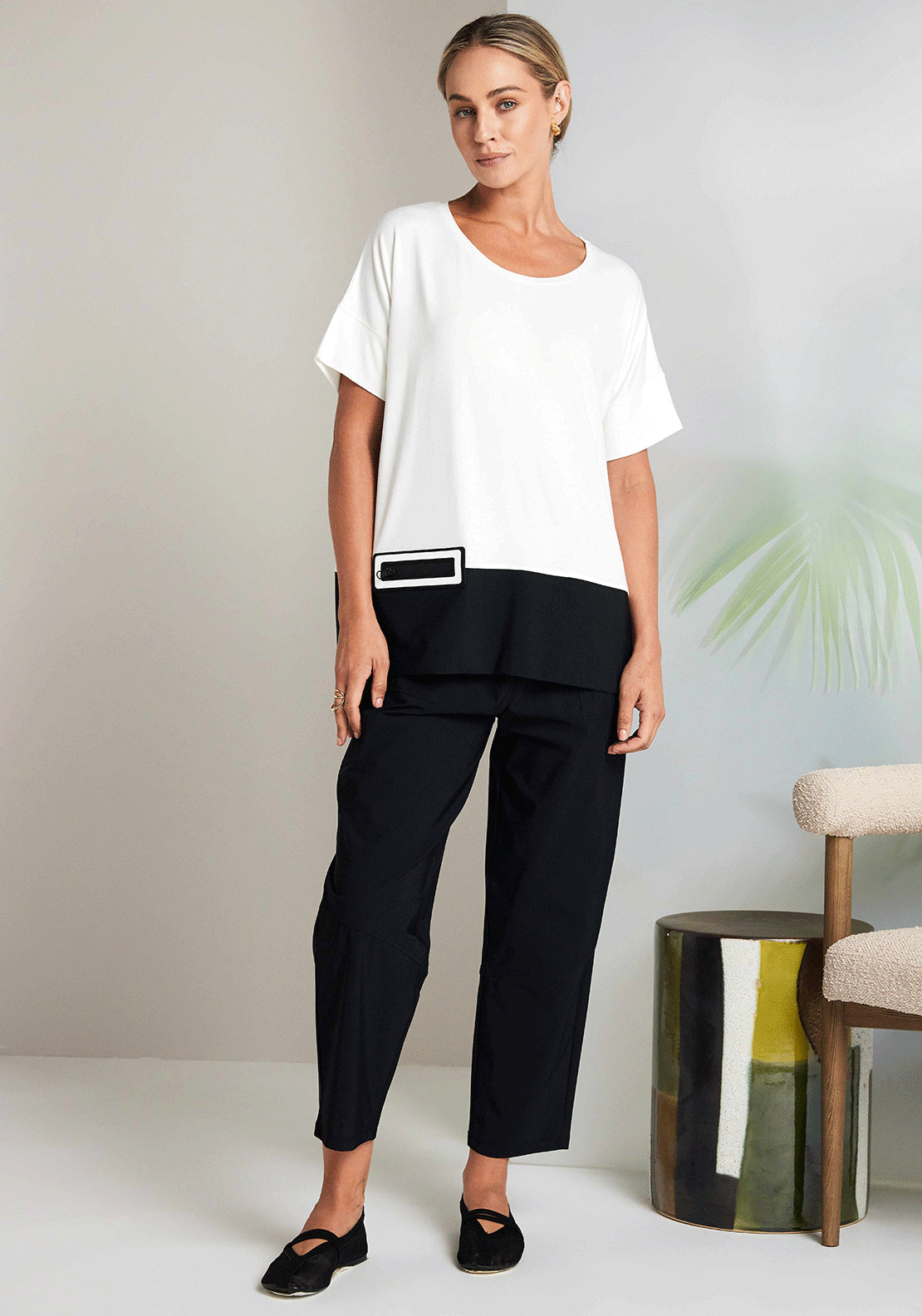 Model wearing black slim barrel leg pant by Naya at Suttles & Seawinds, Mahone Bay, NS