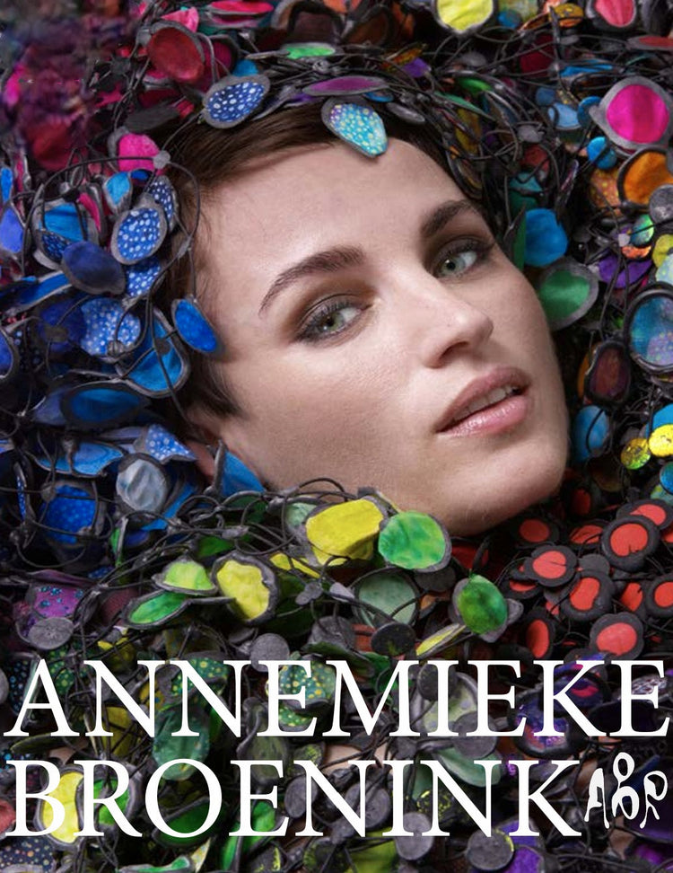 Annemieke Broenink woman's face surrounded by colorful necklaces