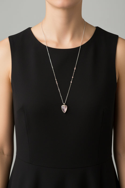 Necklace with a heart-shaped pink pendant on a white background