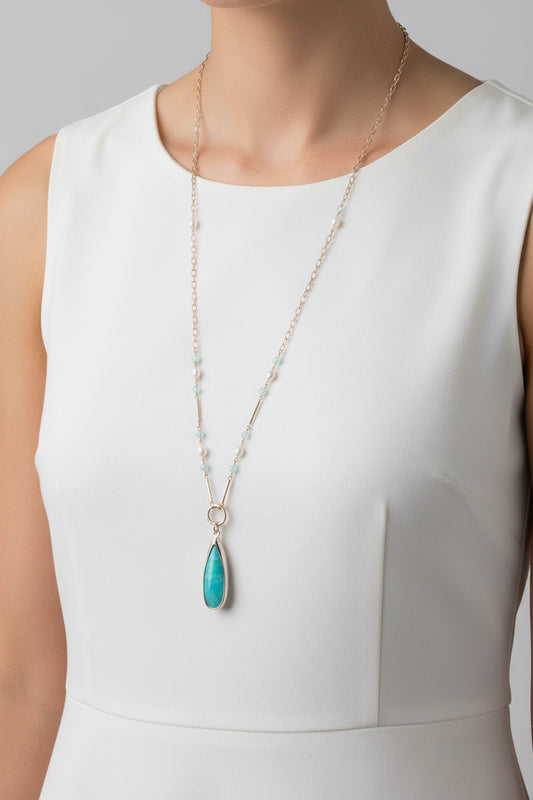 Necklace with a teardrop-shaped pendant on a white background