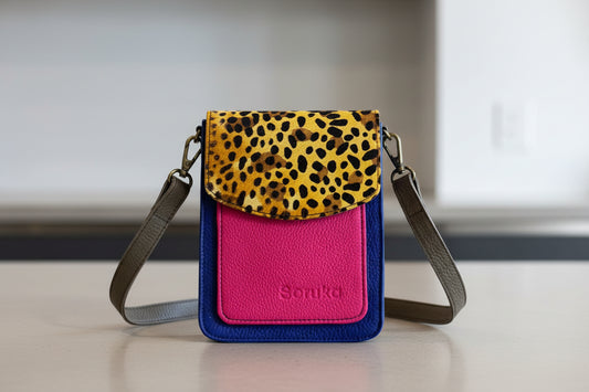 Pink wallet with leopard print flap and long strap 