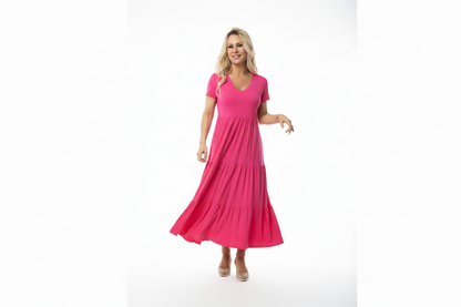 Woman wearing a pink dress on a white background