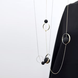 Necklace with circular pendants on a white background