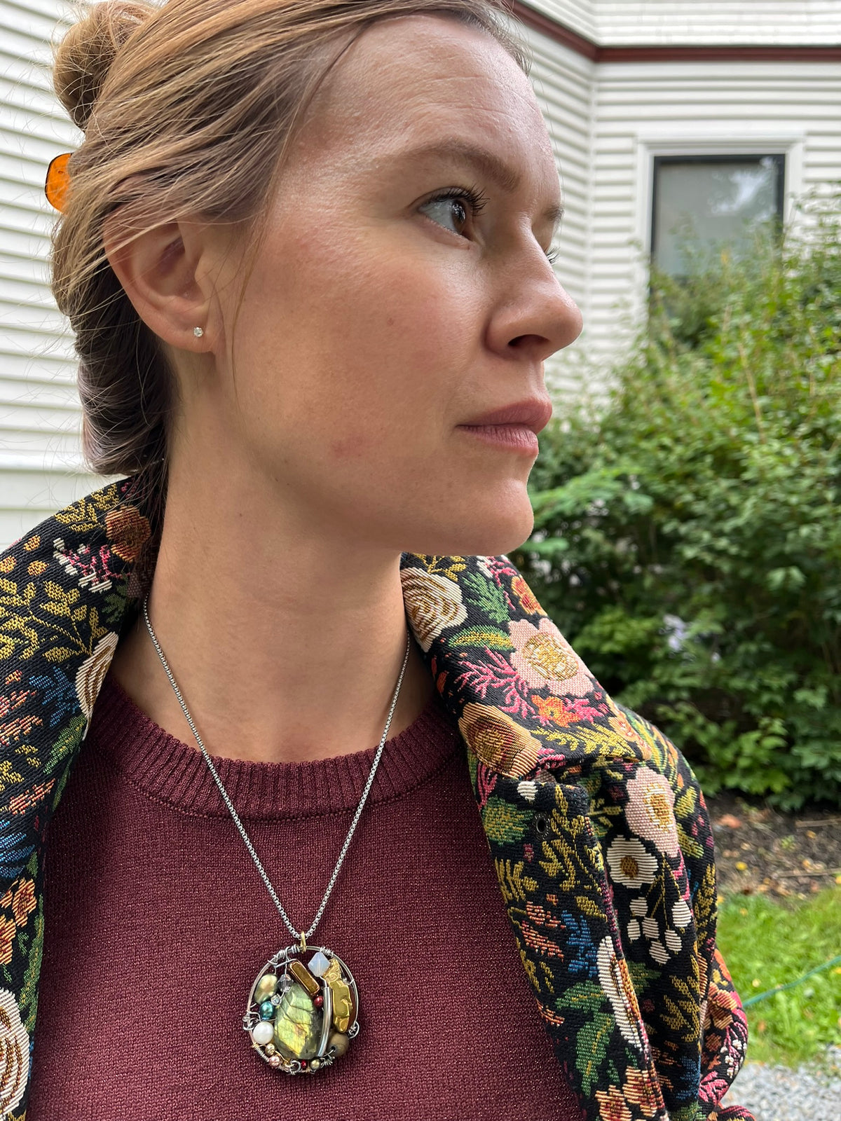 Cari wearing the Minus Meg jacket in black floral with the Minus Liva metallic pullover, Andie midi skirt and a Spring Moon labradorite pendant