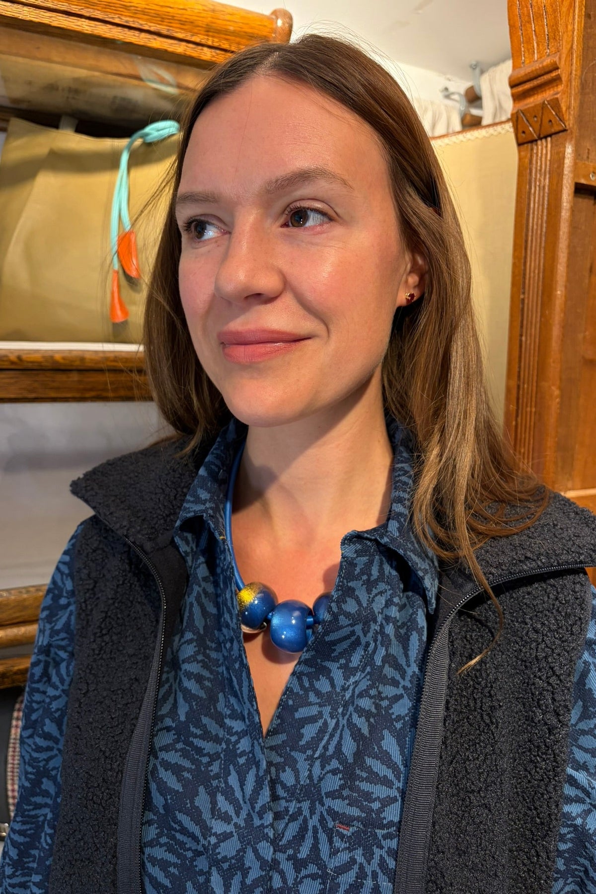 Cari wearing the Ilse Jacobsen Long Fleece Vest over the White Stuff Sage Longline Cord Tunic with a blue Bliss bead necklace