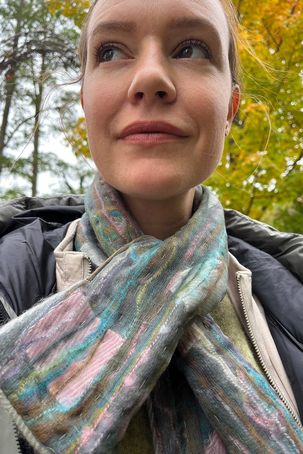 Cari wearing the Normann long hooded puffer coat in sage over a FOIL jacket, Minus Cheryl knit and FOIL Smooth Talker pants, with a Tresart silk muffler scarf and LUV & Co. gloves