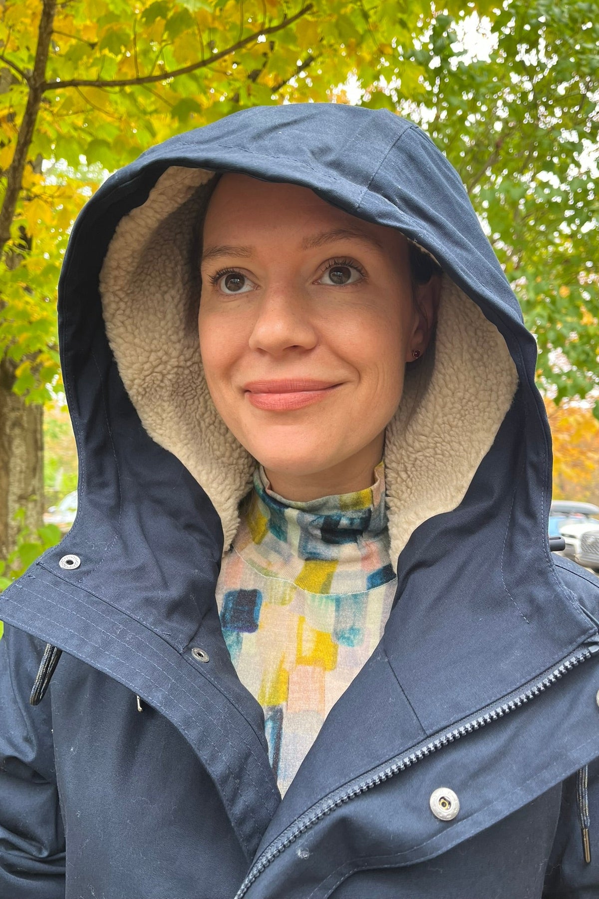 Cari wearing the navy Seasalt Tidesman coat over a Mansted Melina print polo neck and Carreli navy cords, with Brume Waterloo gloves