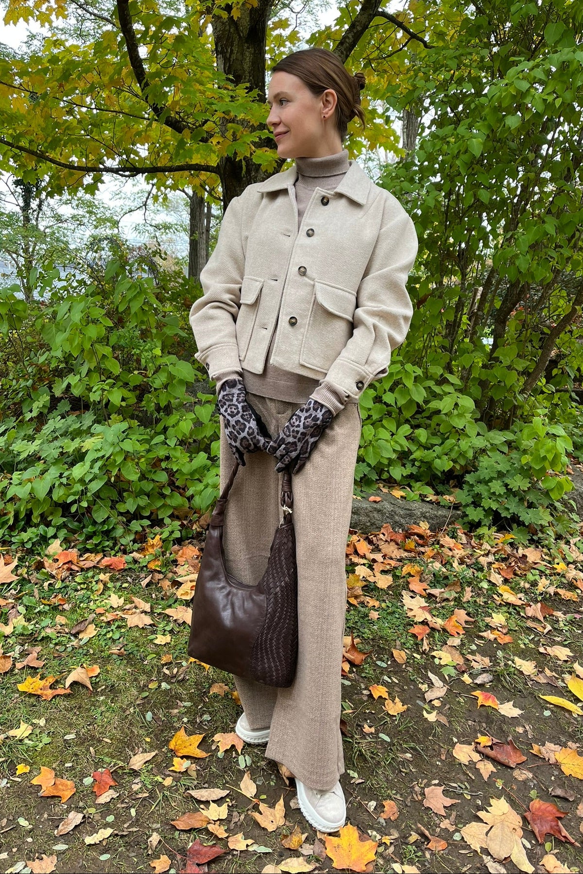 Cari wearing the Ilse Jacobsen short buttoned jacket in wheat, B. Copenhagen turtleneck and Wit & Wisdom Whitney trousers, with the Milo Albany bag and LUV & Co. leopard gloves