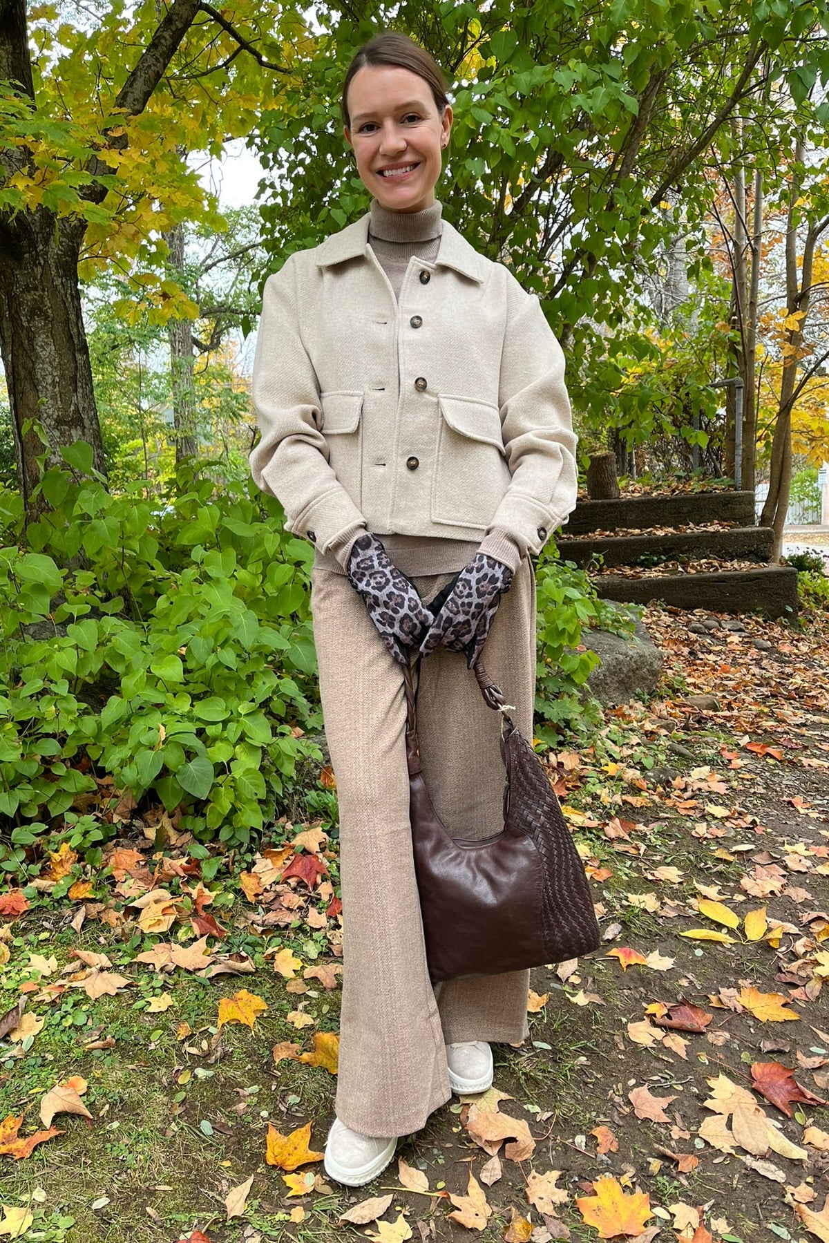 Cari wearing the Ilse Jacobsen short buttoned jacket in wheat, B. Copenhagen turtleneck and Wit & Wisdom Whitney trousers, with the Milo Albany bag and LUV & Co. leopard gloves