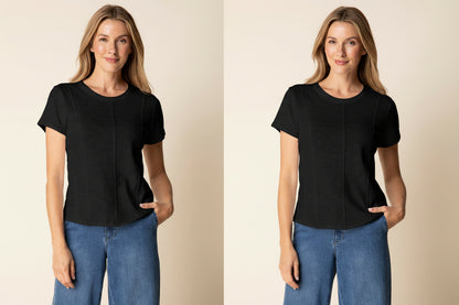 Woman wearing a white blouse and blue jeans against a beige background