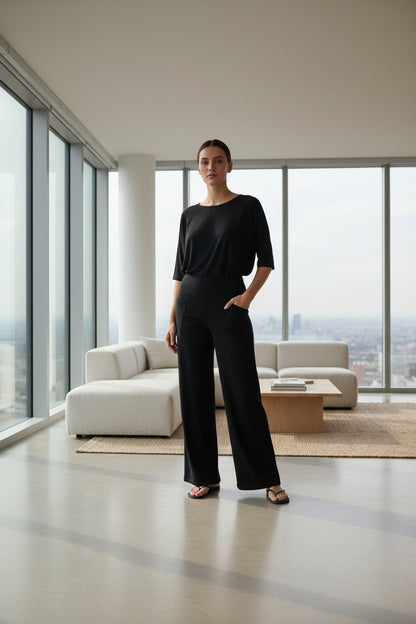 Black wide-leg pants worn by a person 