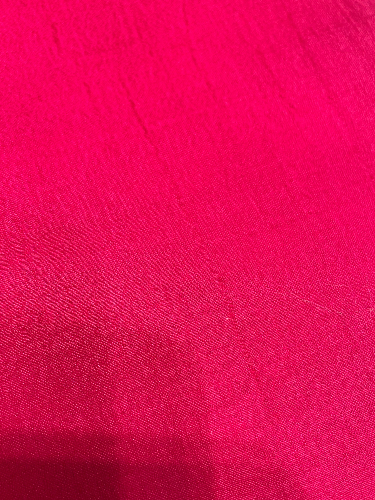 Close-up of a textured pink SCARF surface