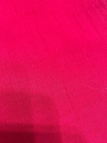 Close-up of a textured pink SCARF surface