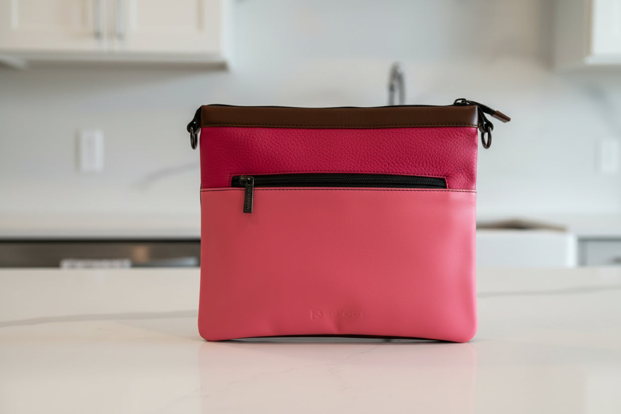 Pink handbag side 1 of 4  with a black zipper 