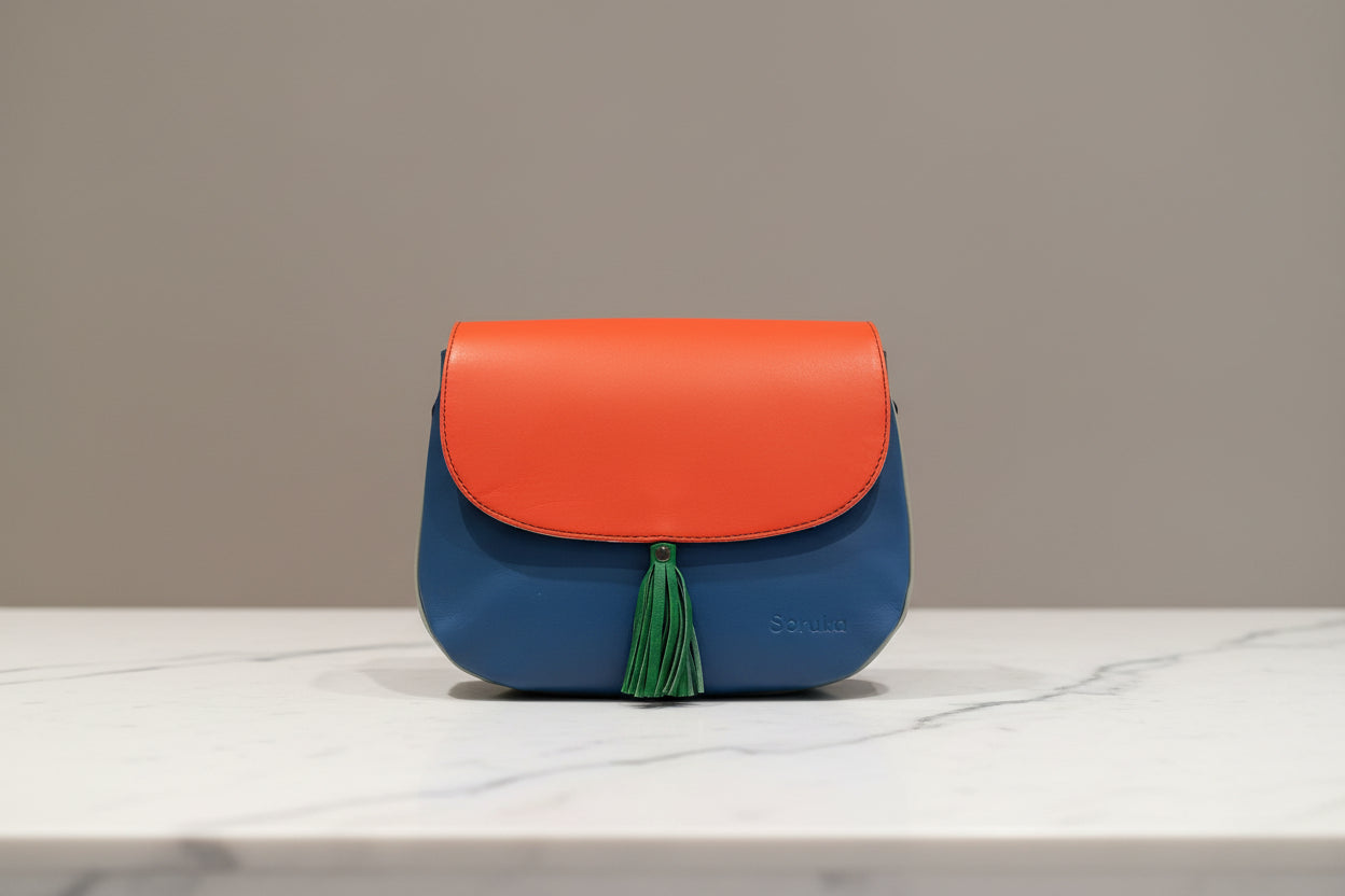 Two-tone orange and blue handbag side 1