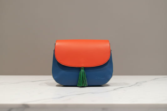 Two-tone orange and blue handbag side 1