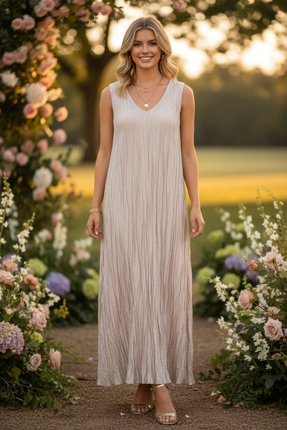 Beige sleeveless dress with a gradient effect on a white background
