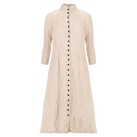 Textured beige long dress with black buttons on a white background