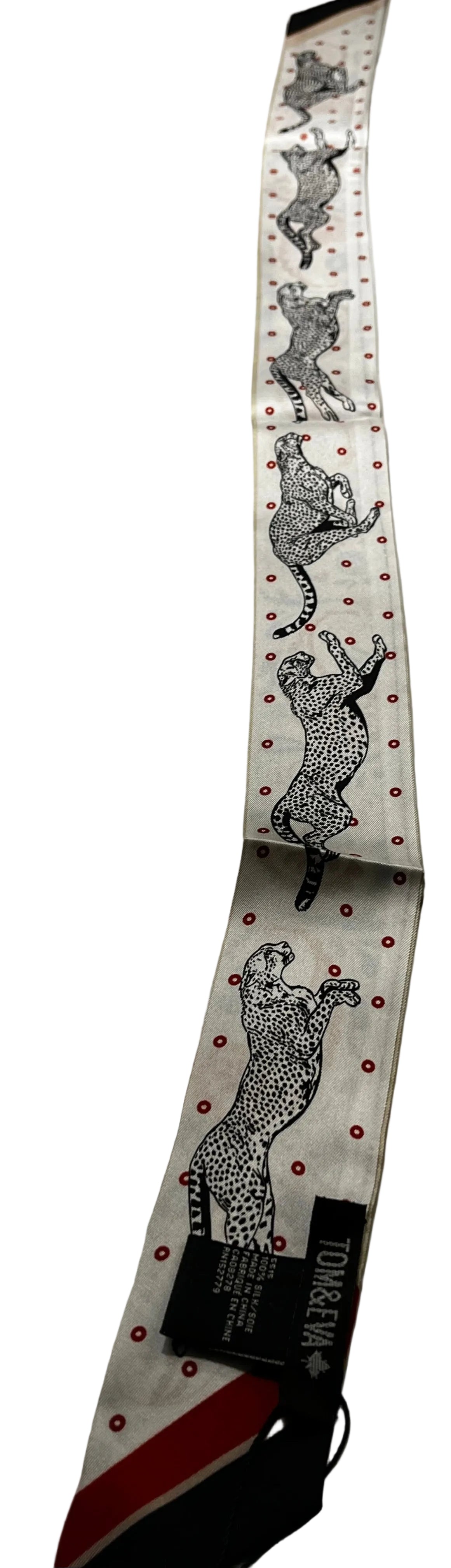 tie scarf with animal print design on a marble surface