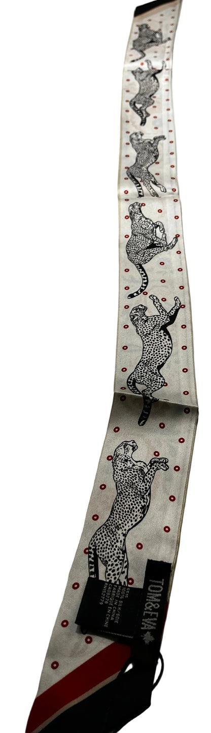 tie scarf with animal print design on a marble surface