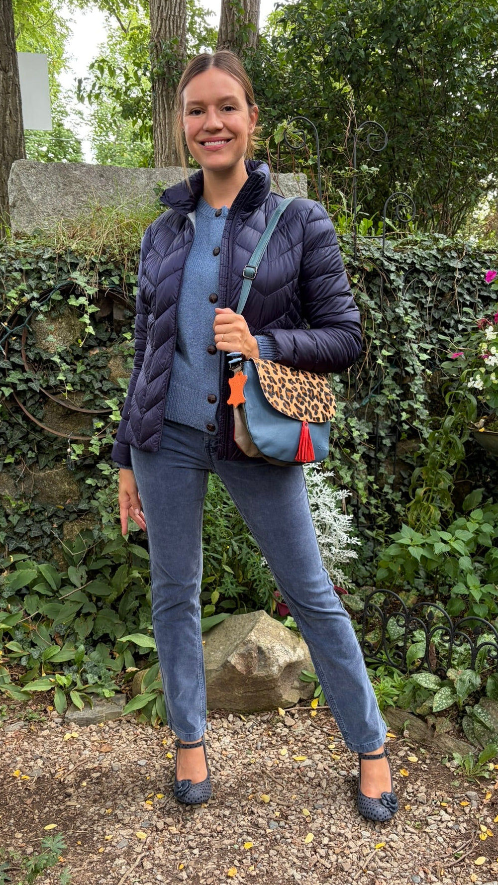 Cari wearing Carreli baby whale cord jeans in azure blue with the IrelandsEye Cassia cardigan and a Junge Daisy down jacket