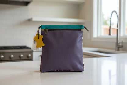 Purple leather handbag side 2 with zipper pocket