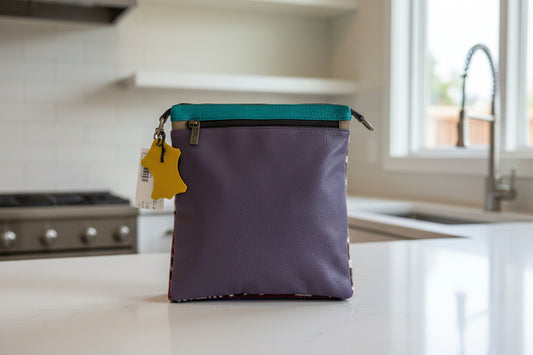 Purple leather handbag side 2 with zipper pocket