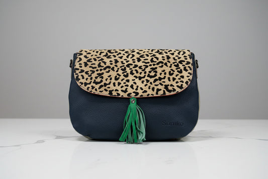 handbag ide 2
dark navy leather with leopard animal print flap and green tassel  
