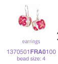 Pair of earrings with turq beads on a white background
