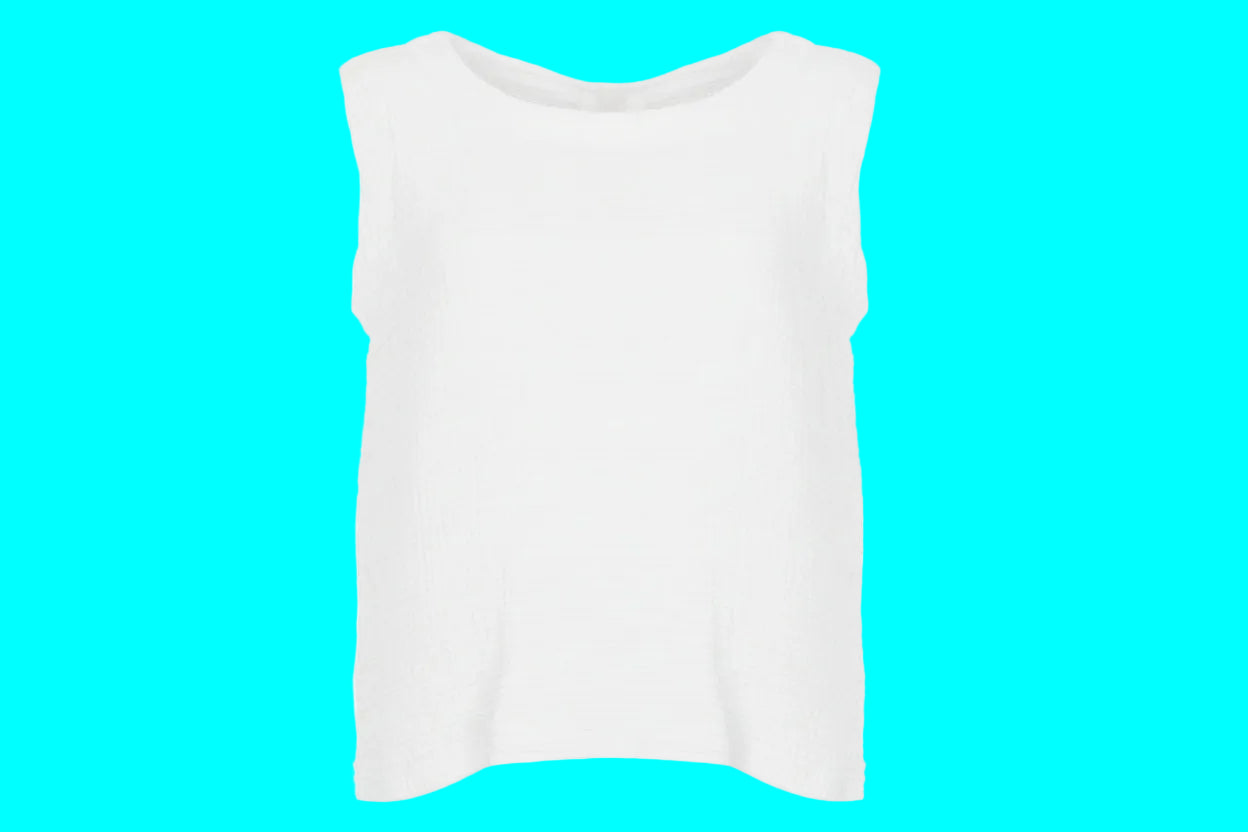 White sleeveless top on a turquoise background