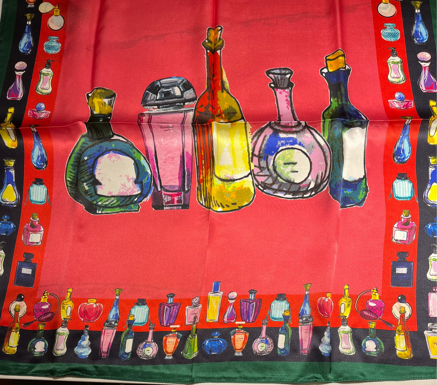 SCARF with colorful SCENT bottles design on a red background