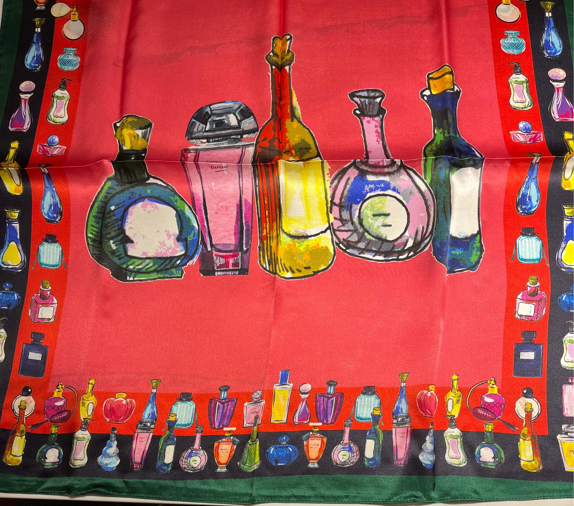 SCARF with colorful SCENT bottles design on a red background