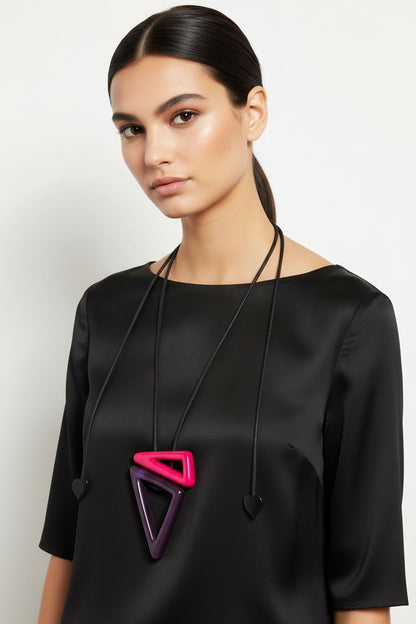 Necklace with a pink and purple triangle pendant on a white background
