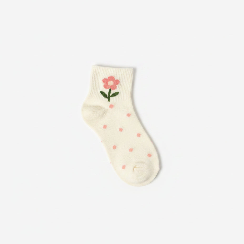 Four pairs of baby socks in a soft cream color, decorated with pink flowers, green stems, and small pink bows, arranged diagonally on a clean white background.