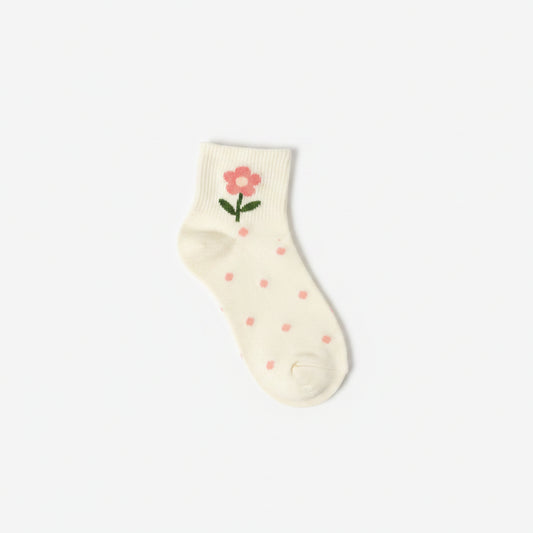 Four pairs of baby socks in a soft cream color, decorated with pink flowers, green stems, and small pink bows, arranged diagonally on a clean white background.