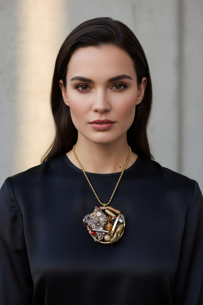 Jewelry pendant with geometric design on a white background