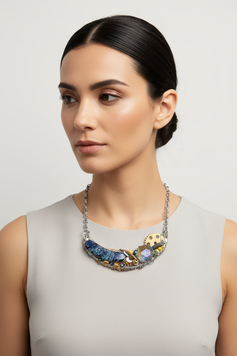 Necklace with blue and gold elements on a white background