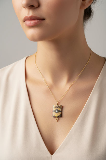 Geometric necklace with eye design on a white background
