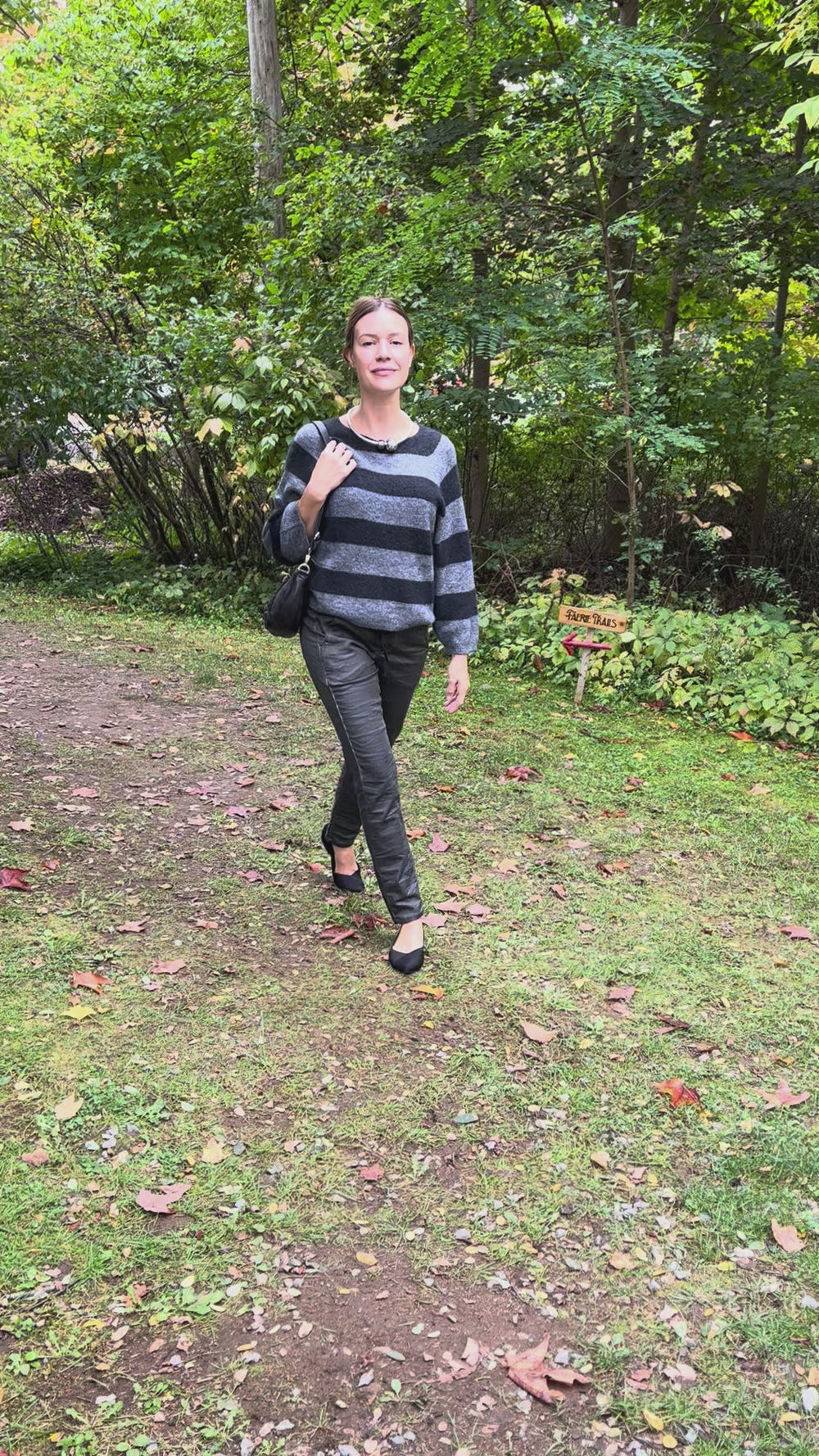 Cari wearing the Alembika Steele stripe sweater with Alembika grey jeans, a Milo rose leather handbag and Zsiska Bliss necklace
