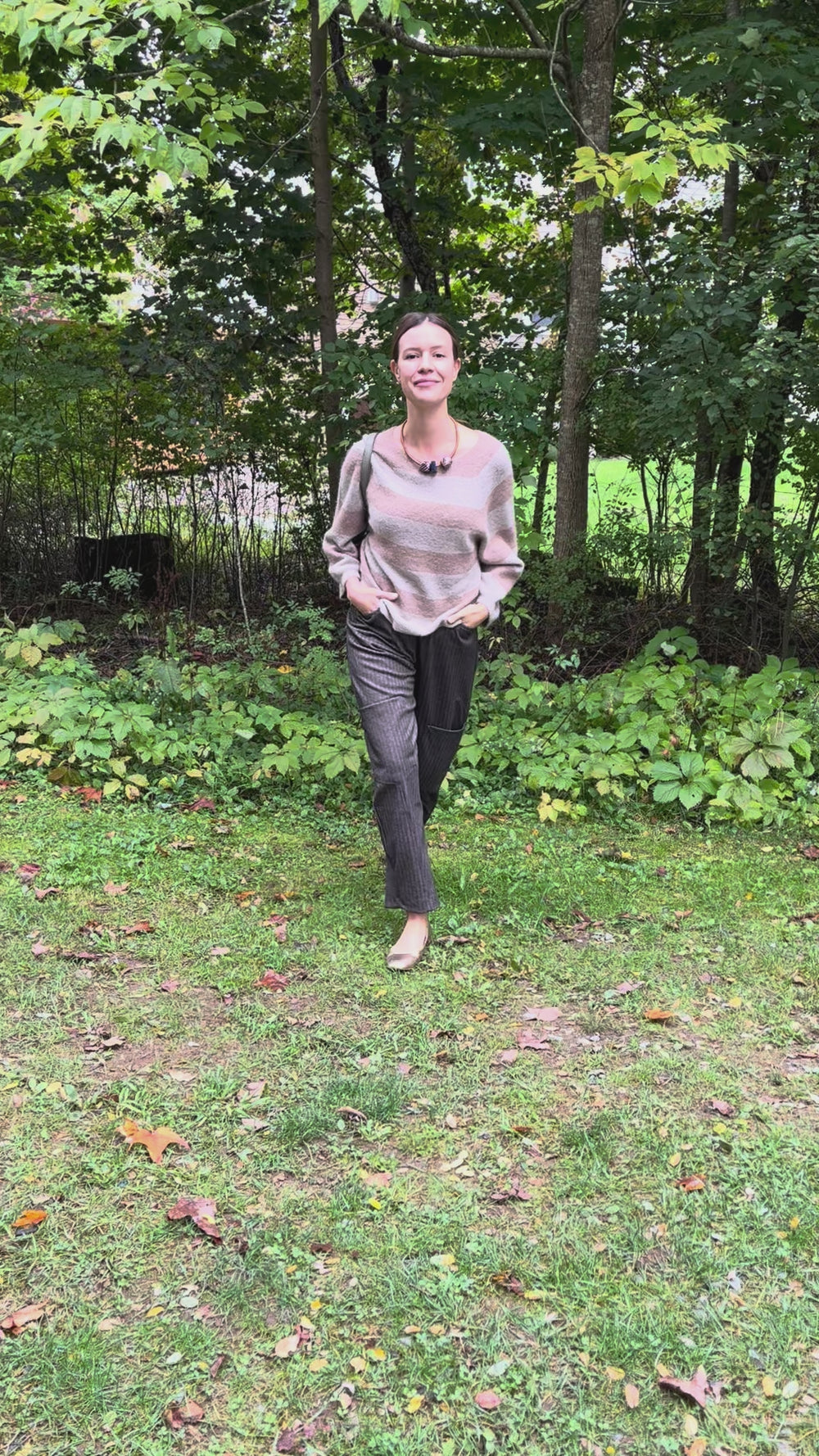 Cari wearing the Alembika Latte stripe sweater with Alembika taupe pants, a Soruka Celine shoulder bag and Zsiska Bliss necklace