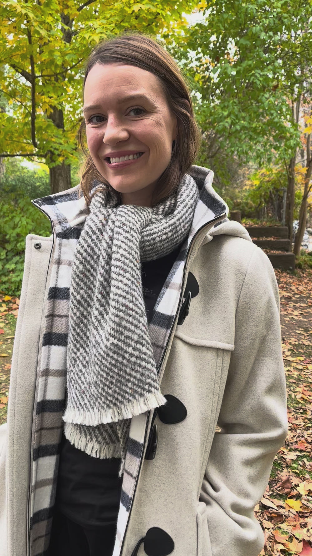 Cari wearing the Junge Sophie duffel coat in ecru with a Mucros Aran scarf, Dolcezza black mock neck top and Seasalt Waterdance trousers