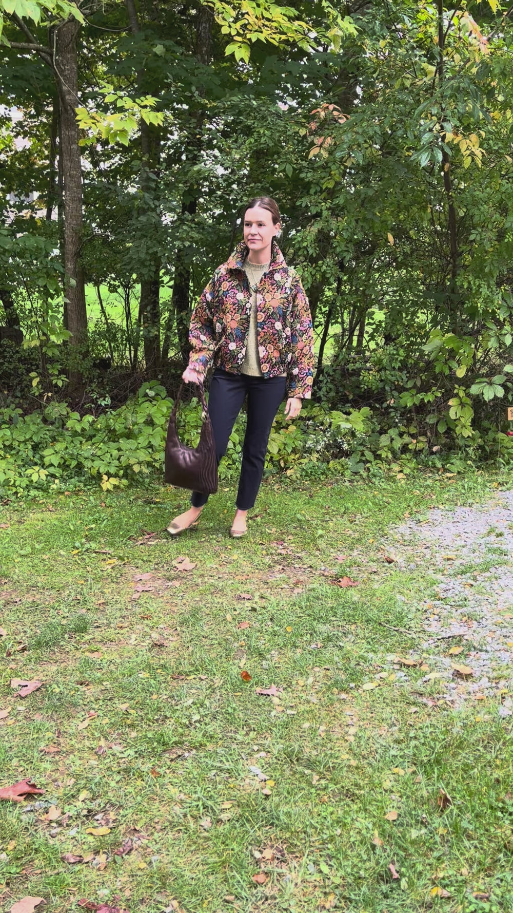 Cari wearing the Minus Meg jacket in black floral with the Minus Cheryl knit in fir green, FDJ Olivia slim ankle jeans and a Milo leather purse