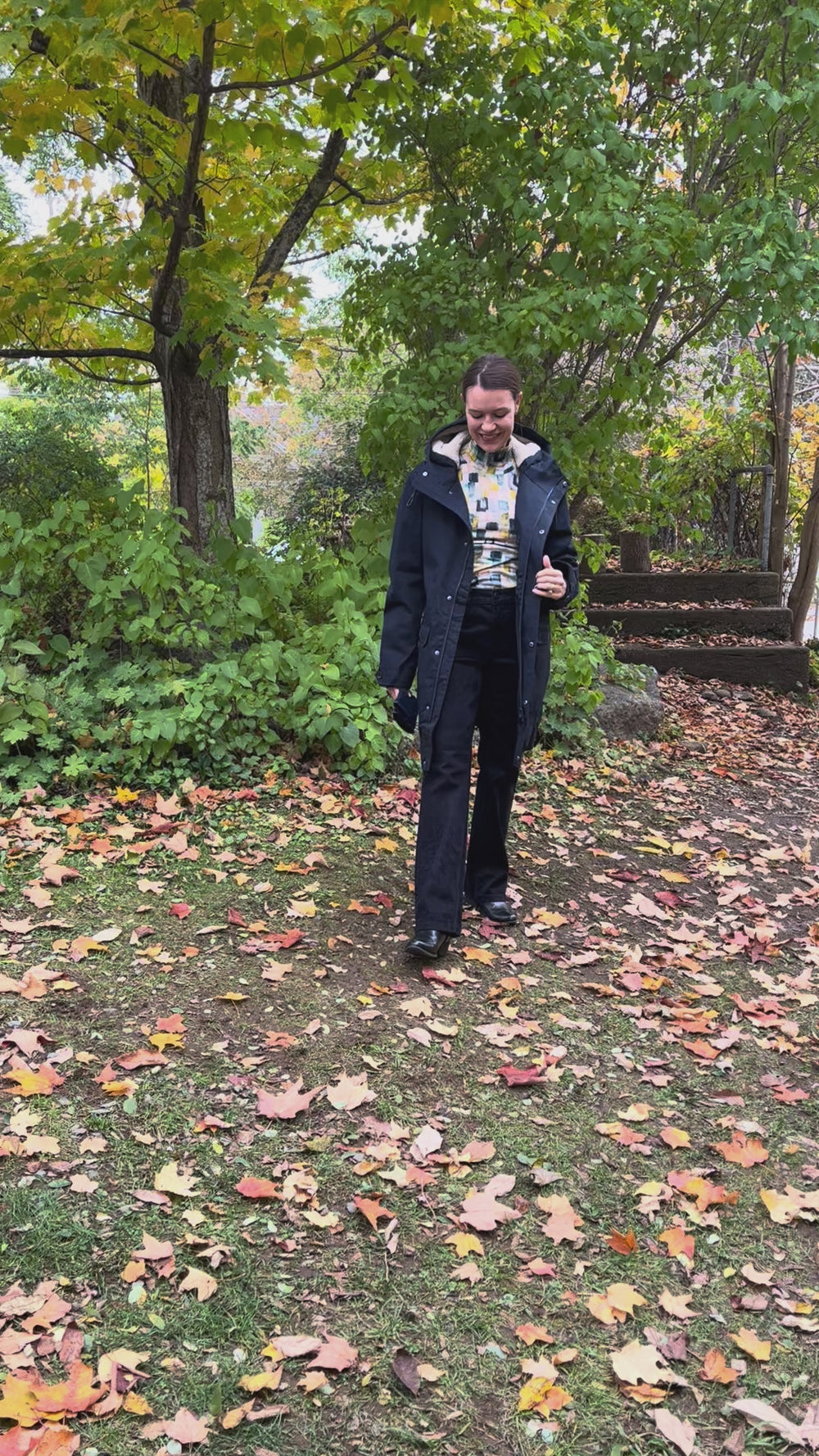 Cari wearing the navy Seasalt Tidesman coat over a Mansted Melina print polo neck and Carreli navy cords, with Brume Waterloo gloves