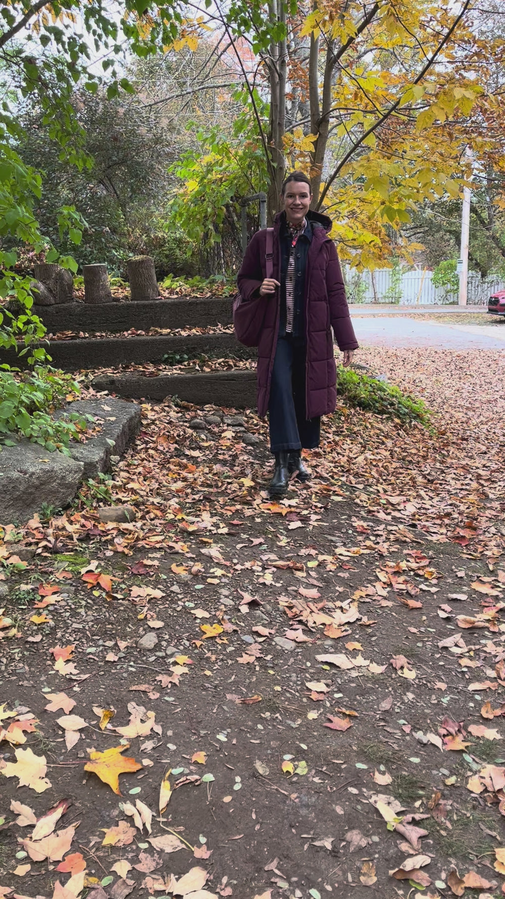 Cari wearing the Normann mid calf puffer in plum over a White Stuff Eden denim jacket, Imogen shirt and Tia jeans, with a Skyla crossbody bag and Lyla + Luxe skinny scarf