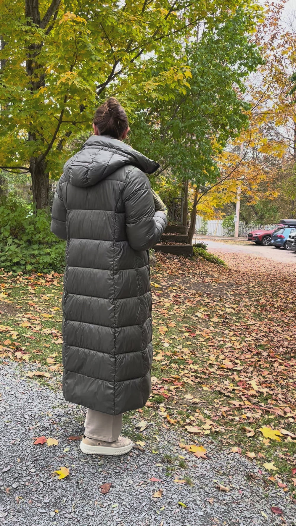 Cari wearing the Normann long hooded puffer coat in sage over a FOIL jacket, Minus Cheryl knit and FOIL Smooth Talker pants, with a Tresart silk muffler scarf and LUV & Co. gloves