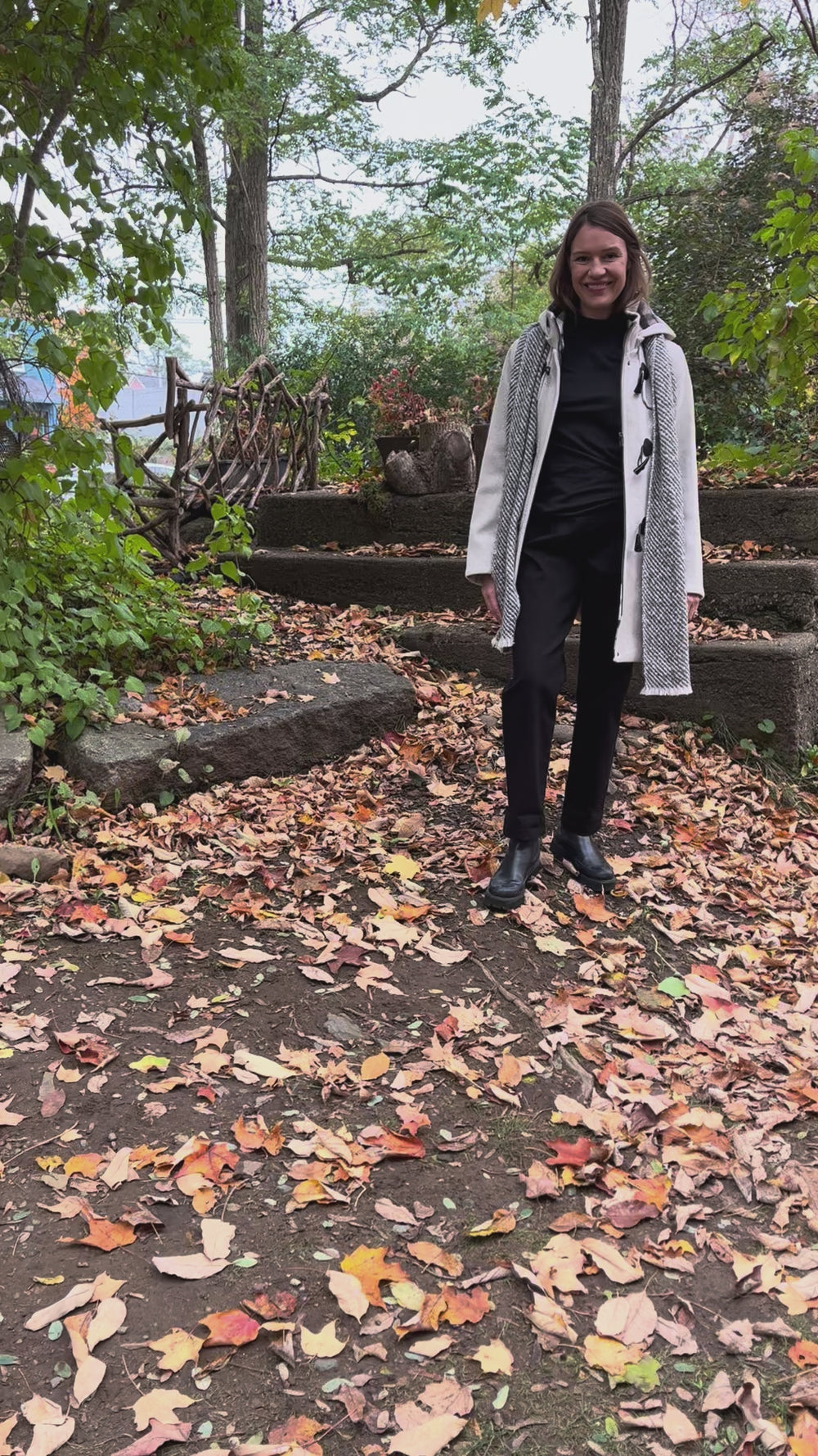 Cari wearing the Junge Sophie duffel coat in ecru with a Mucros Aran scarf, Dolcezza black mock neck top and Seasalt Waterdance trousers