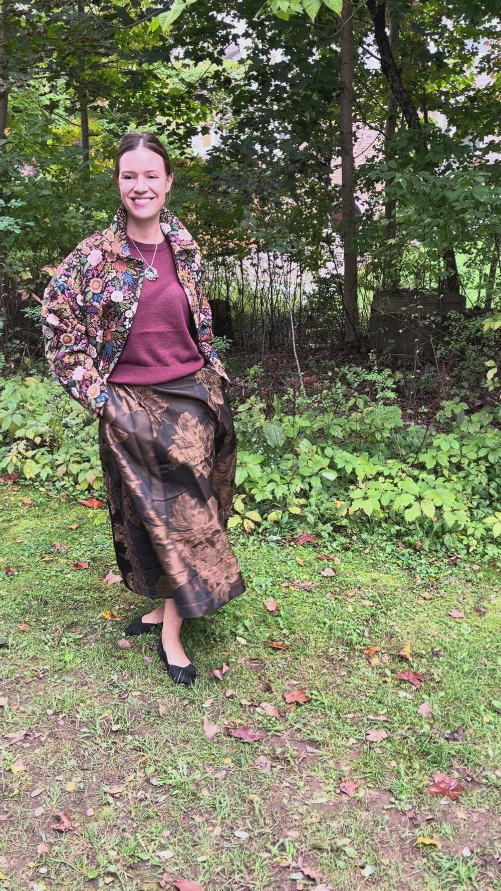Cari wearing the Minus Meg jacket in black floral with the Minus Liva metallic pullover, Andie midi skirt and a Spring Moon labradorite pendant