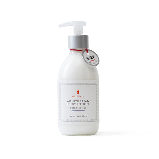 White body lotion bottle with pump on a white background