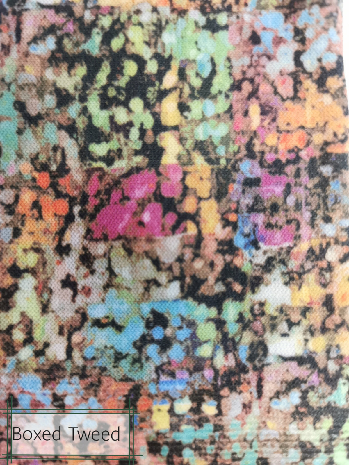Multicolored textured fabric with 'Boxed Tweed' label